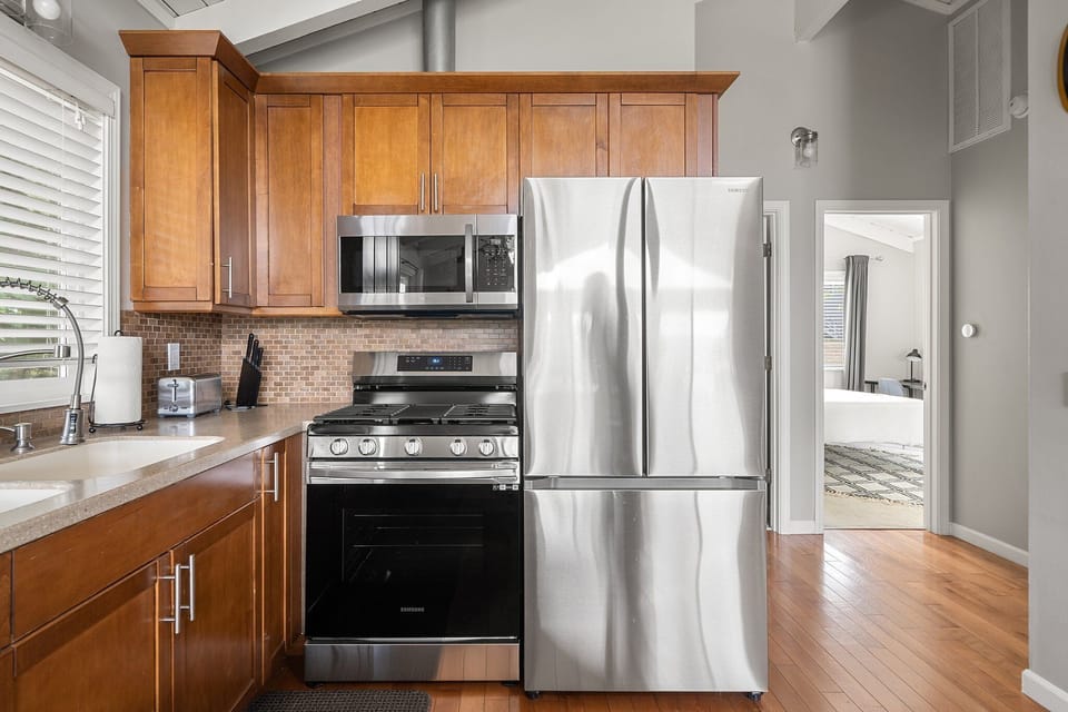 The kitchen is equipped for everyday cooking, with a full range of appliances and the tools needed to prepare meals.