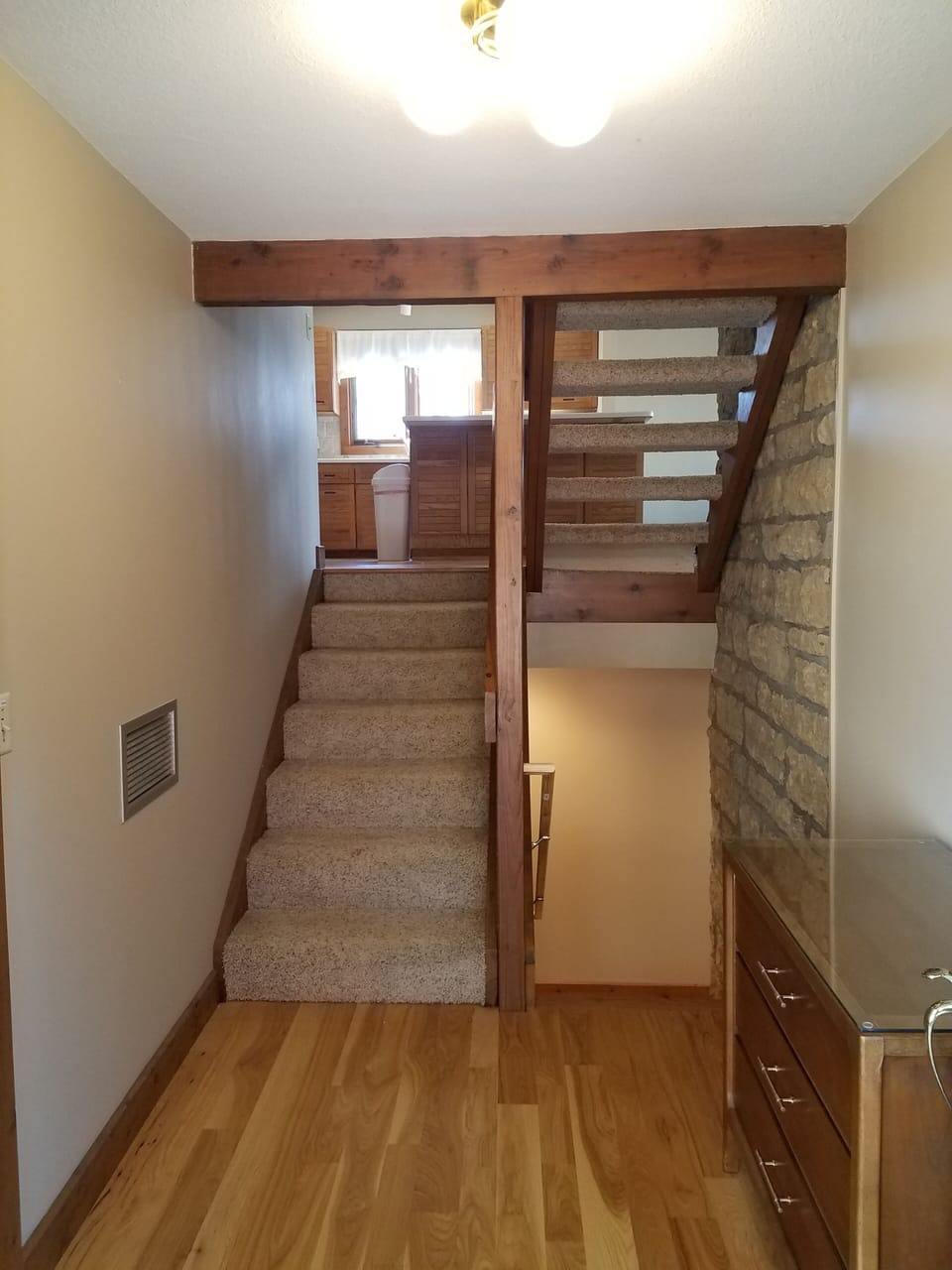 Foyer with staircase up to main living area and down to bedrooms.
