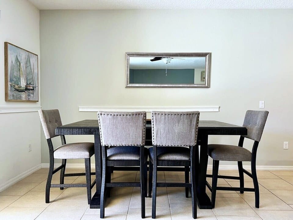 The spacious open-concept dining room has ample seating, making it easy for everyone to enjoy meals together after a day of Florida adventures