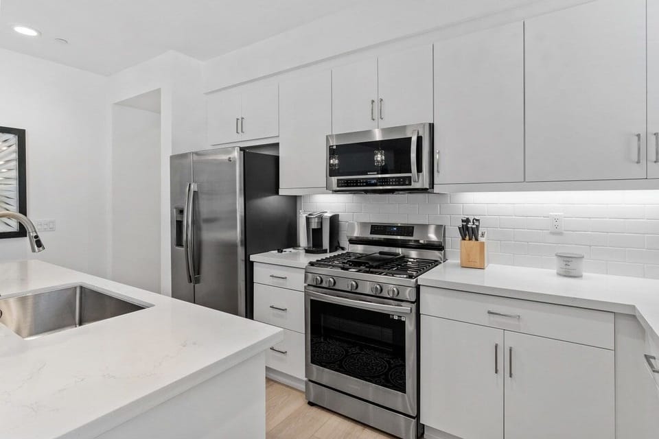 Stainless steel appliances and plenty of prep space for cooking.