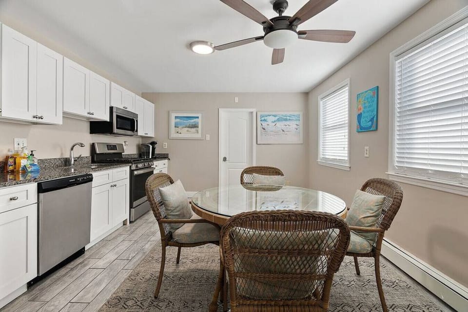 Gather around the elegant dining table in this beautifully appointed room, perfect for enjoying a meal with friends and family.
