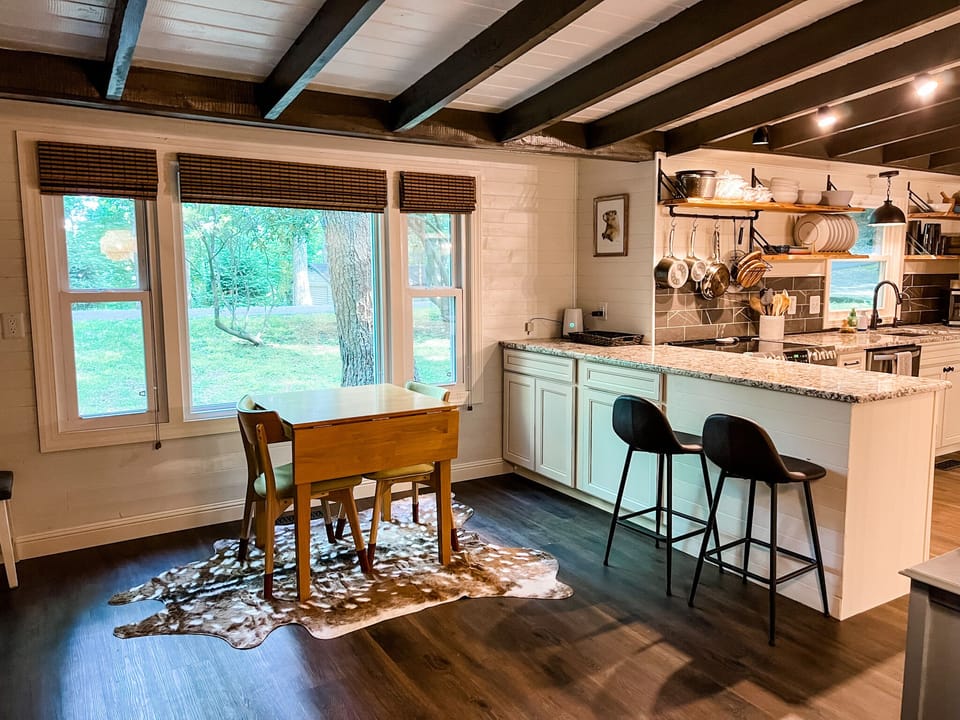 Dedicated workspace leading to the kitchen. Wood Fireplace. Seasonal Use