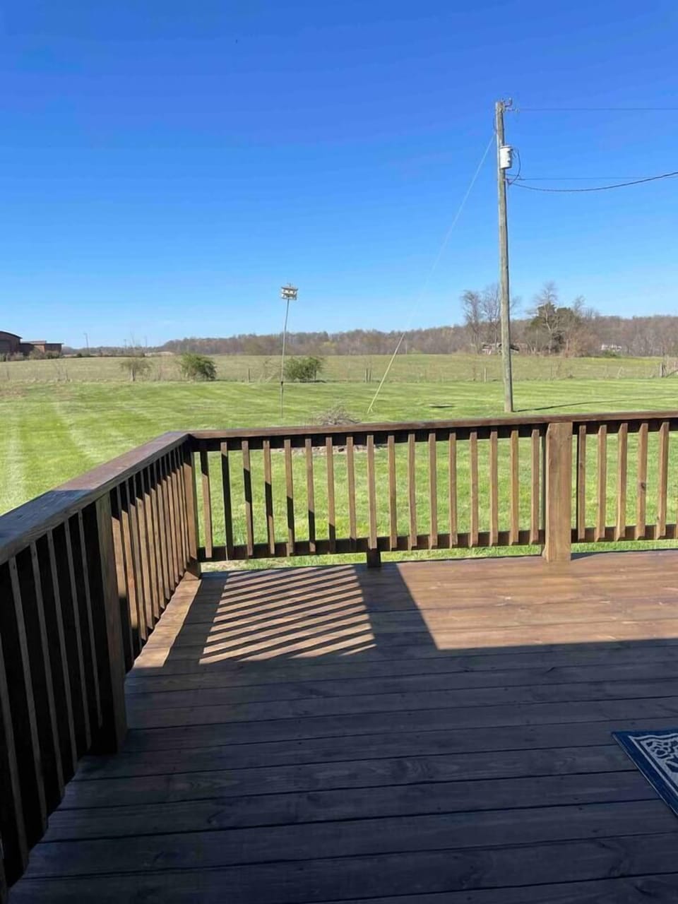 Look for wildlife from the deck of this peaceful back yard!