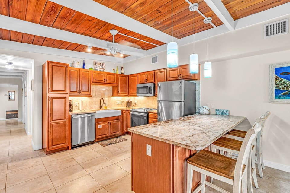 Fully stocked kitchen, stainless steel appliances and granite counter tops