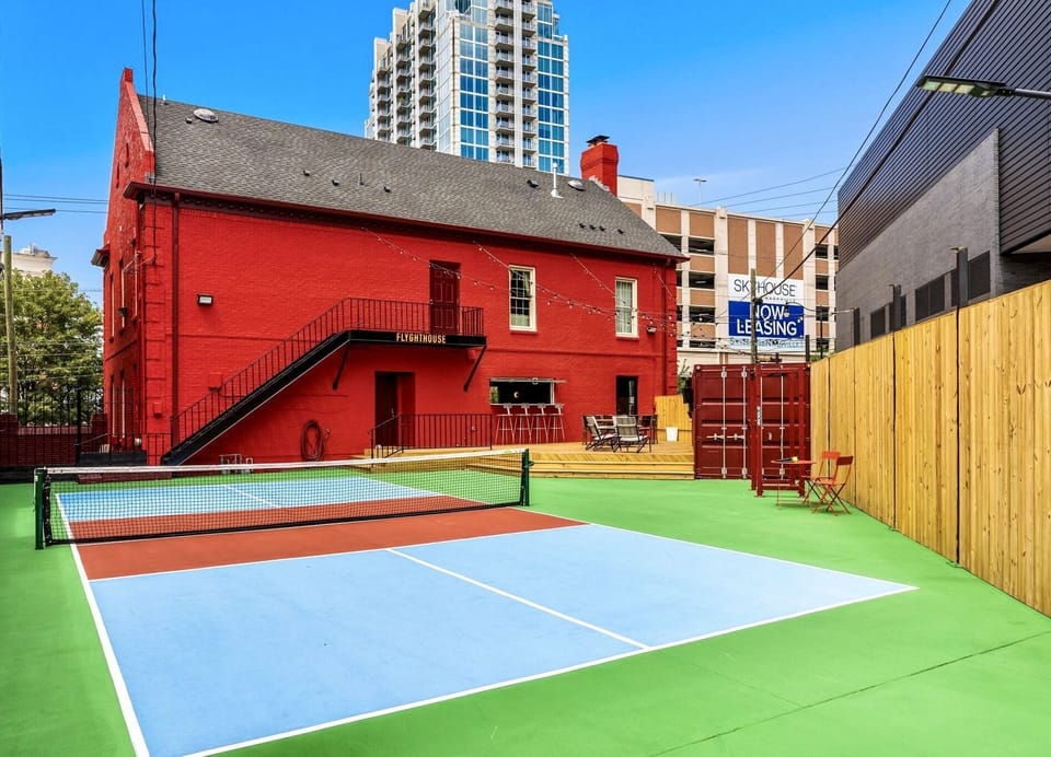 Game on! Our private pickleball court is ready for action. Our outdoor area has an outdoor tv and speakers, cornhole boards, gas grill, outdoor bar, giant Jenga, and a full gym setup.