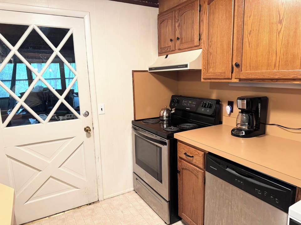 Kitchen opens to screened in porch in back