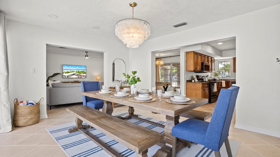 Share meals and moments at a beautiful dining table with cozy seating for up to eight guests.