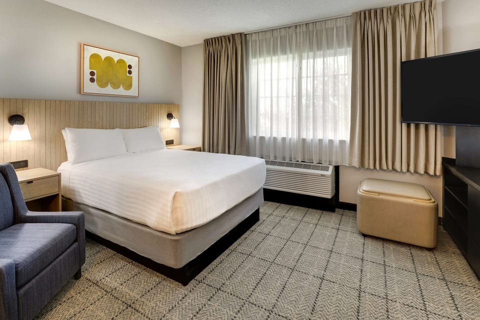 Unwind in a crisp, cloud-soft bed after busy days.