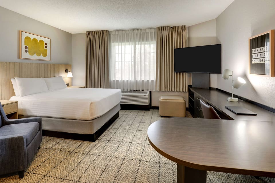 Settle in with a spacious room, desk, and big TV.