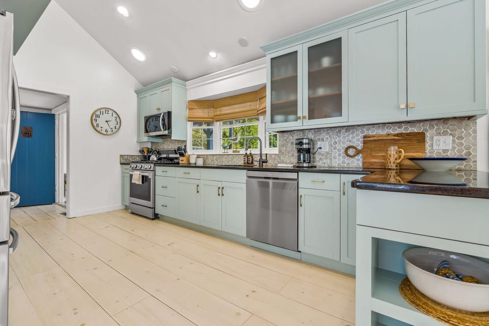 The kitchen is modern and spacious.