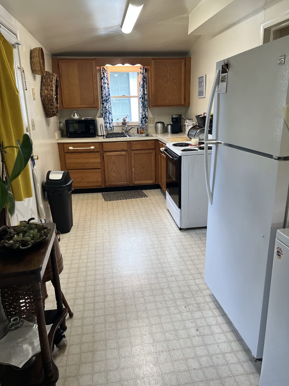 View of Kitchen sink, stove and microwave 