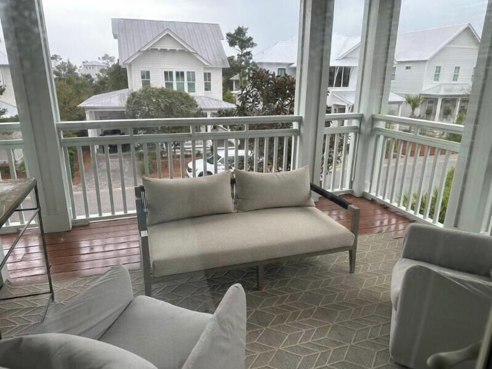 Upper level covered patio with seating. Access through guest bedroom 1 and 2