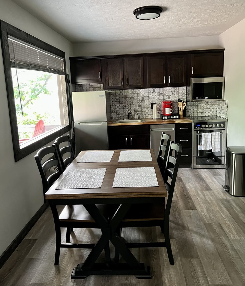 Dining area and fully stocked kitchen
