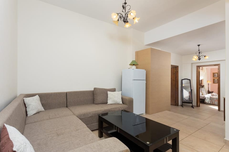 Living area with sofa and kitchenette 