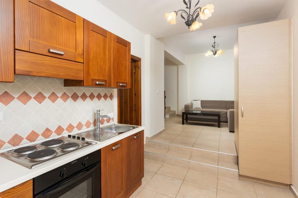 Living area with sofa and kitchenette 