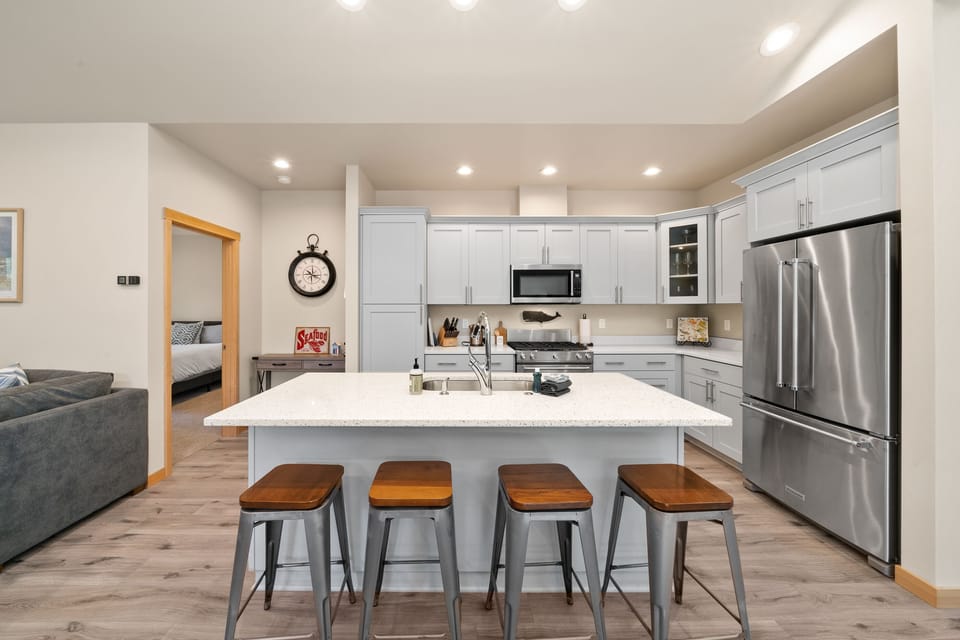 Beautiful kitchen with all new appliances, Gas range, dishwasher, Fridge, microwave, and breakfast bar.
