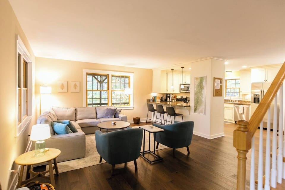 Cozy and inviting living room with beautiful wooded views 