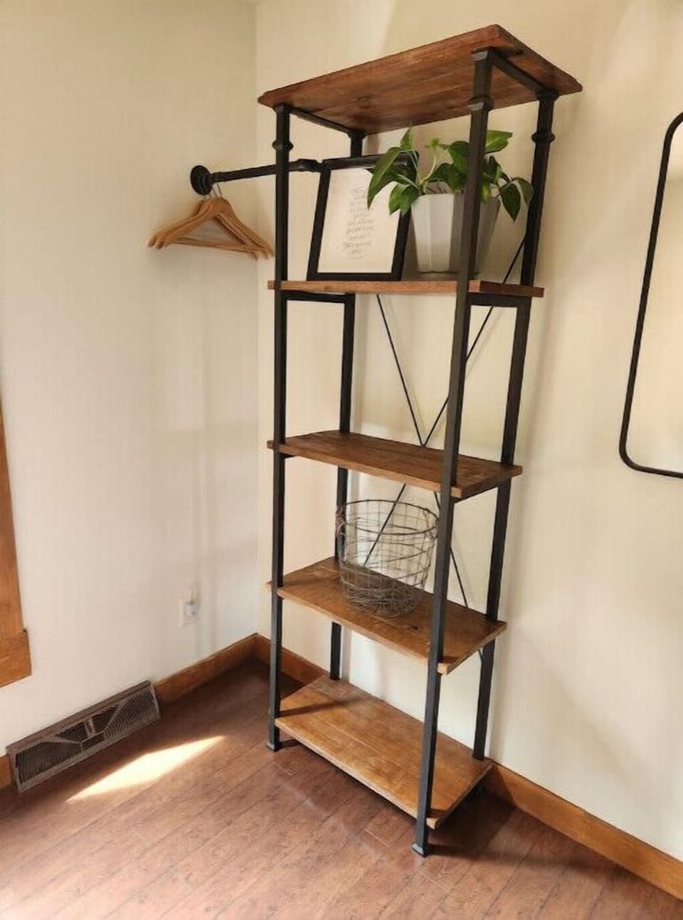 Shelving and clothes rack in bedroom 3