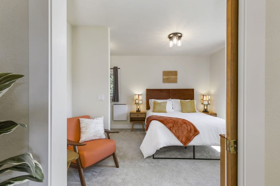 Bedroom with smart TV, high quality queen mattress, dresser, reading nook, desk