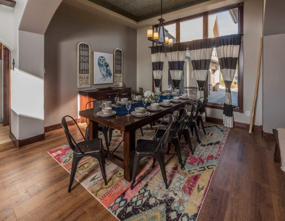 Seating for 10 at the dining table with additional seating for 4 at the bar. 