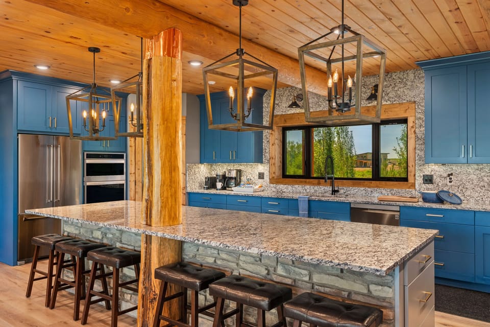 Large granite countertops provide plenty of space for meal prep.