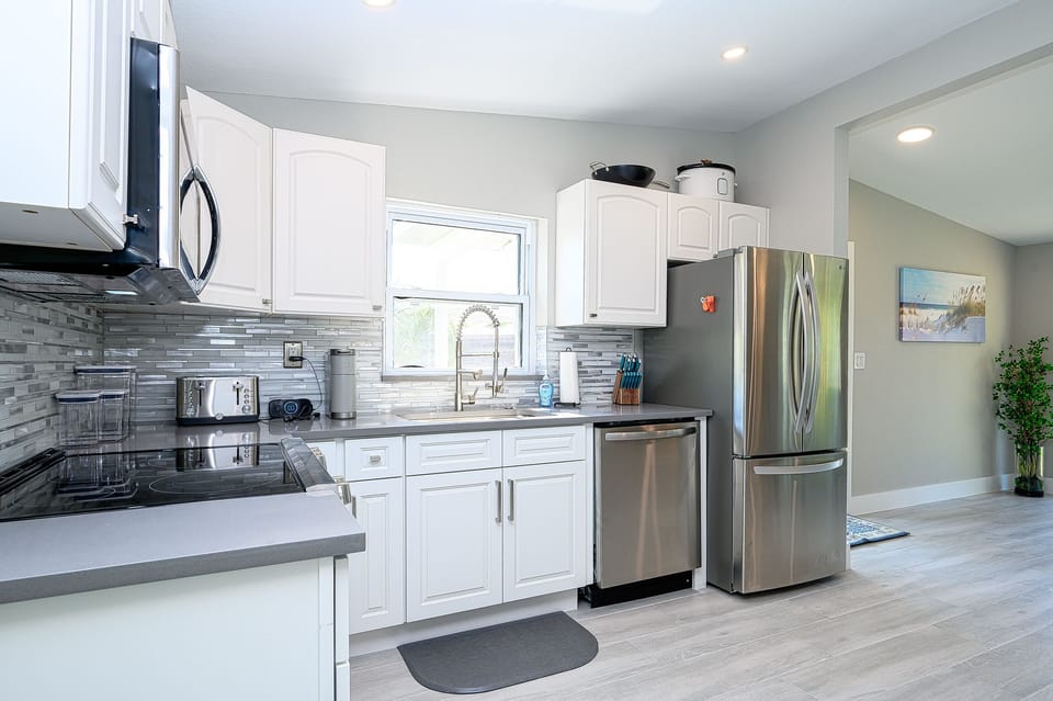 Kitchen with dishwasher/frig/freezer/stove/oven/microwave