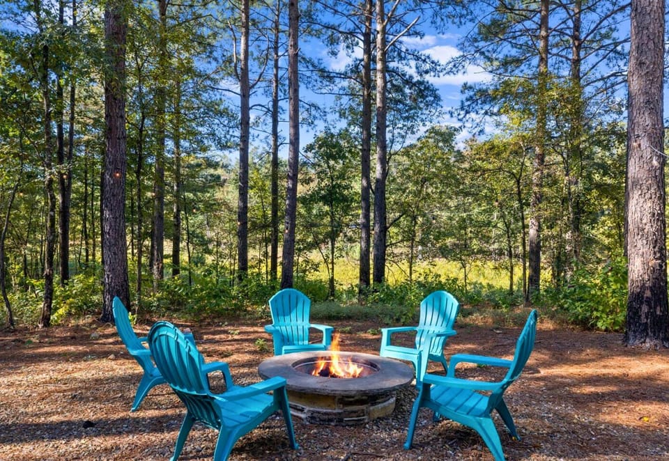 Warmth and woodland whispers meet at our cozy outdoor firepit.