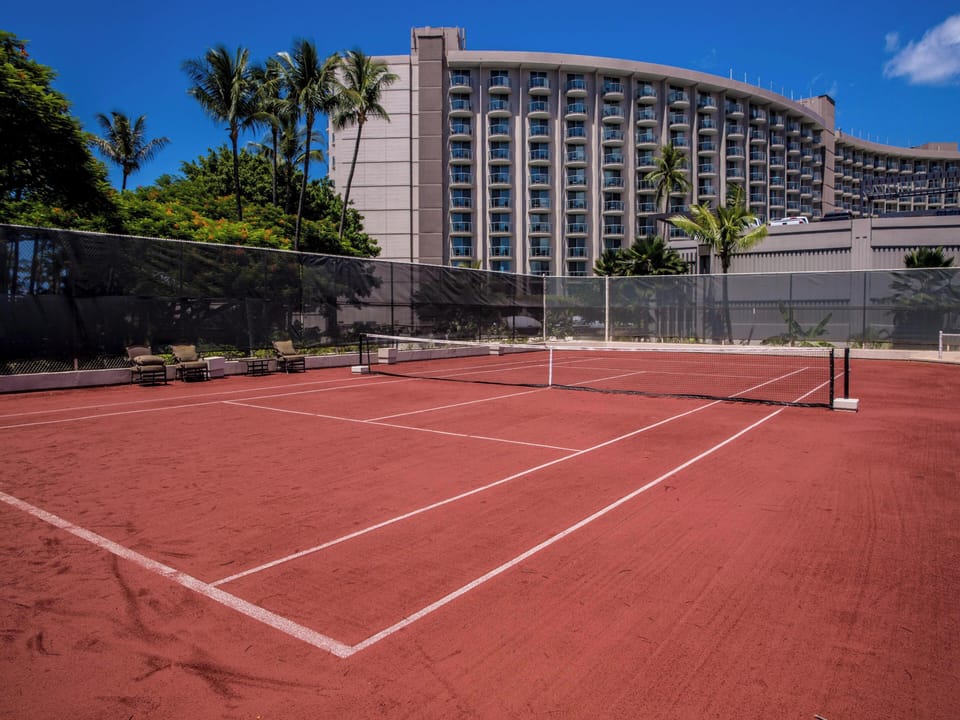 Clay tennis courts provide a unique playing option for tennis enthusiasts. Check out rackets and balls at the front desk.