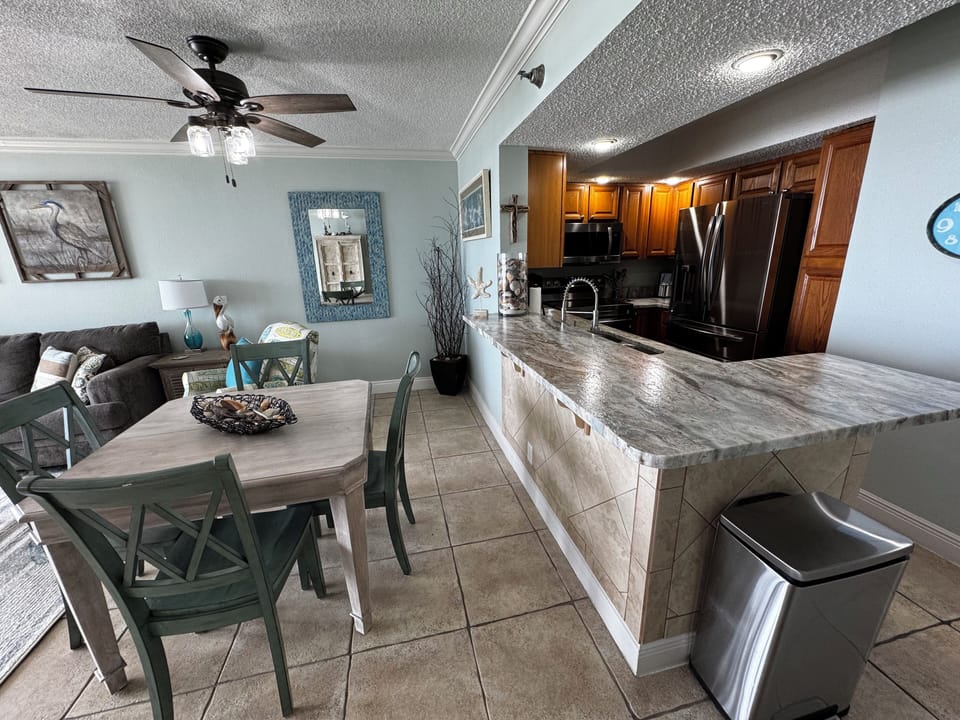 Kitchen and dining room.  Table is new and will expand with self-storing leaf.