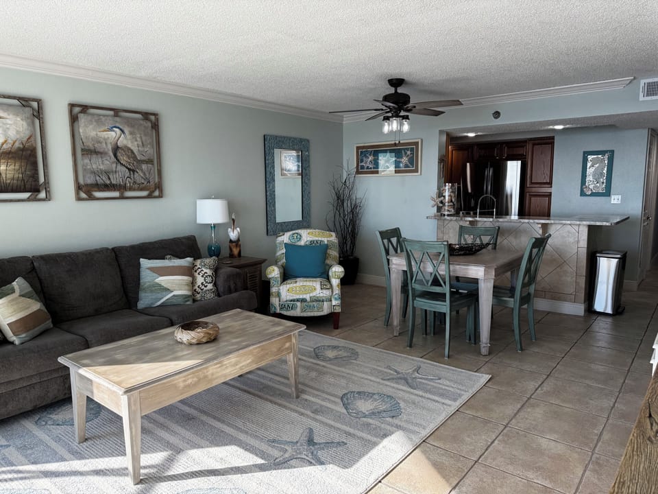Living room with view into the kitchen.