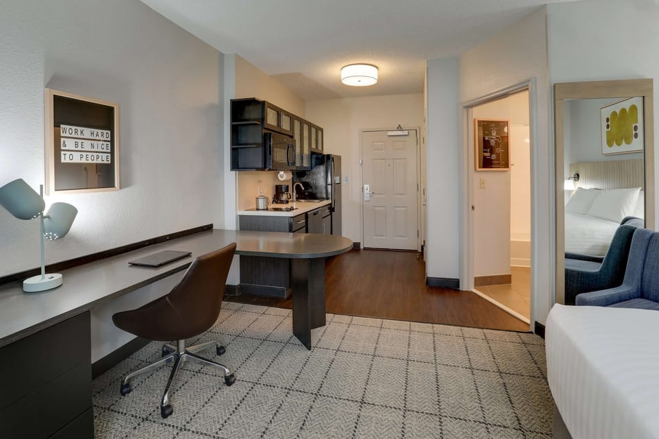 Spread out comfortably with a dedicated desk and dining table.