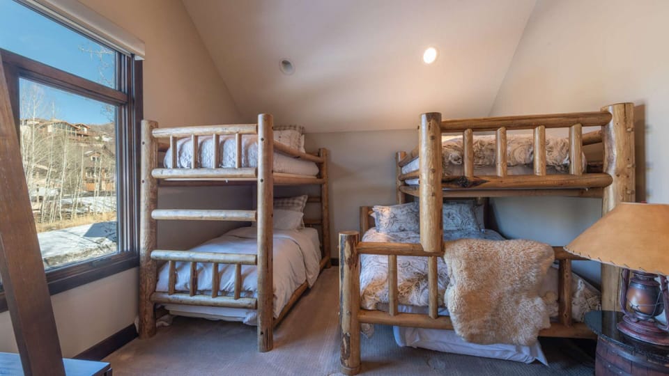 Bedroom 4 features a twin-over-twin bunk bed and a twin-over-full bunk bed.