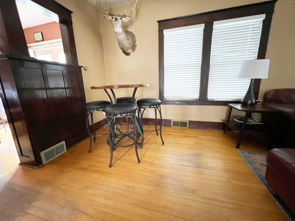 Enjoy a drink at the high top cocktail table in the living room