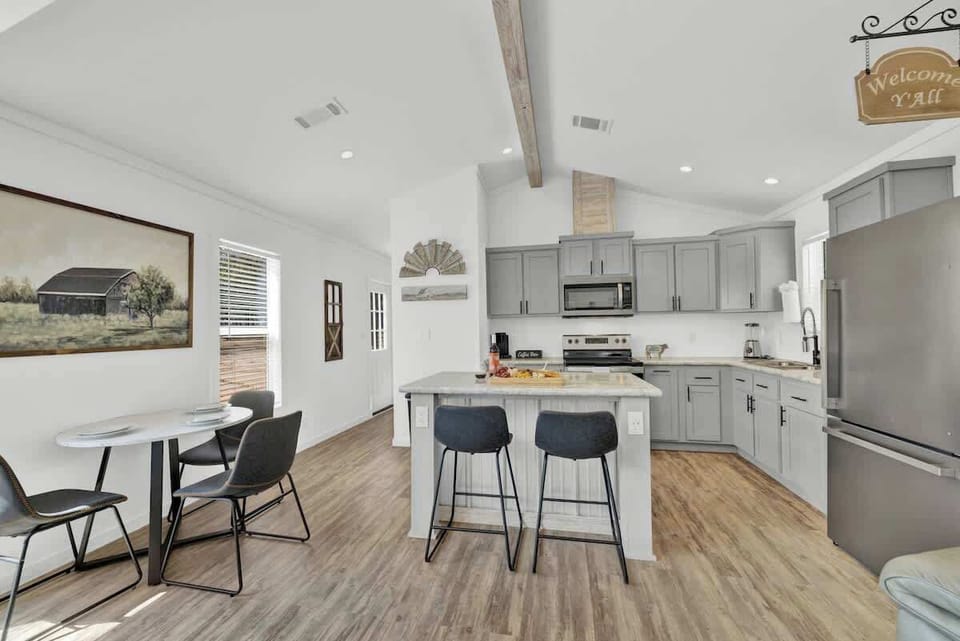 The tiny home's full kitchen is a compact marvel, equipped with all the essentials for culinary creativity in a charming and efficient space.