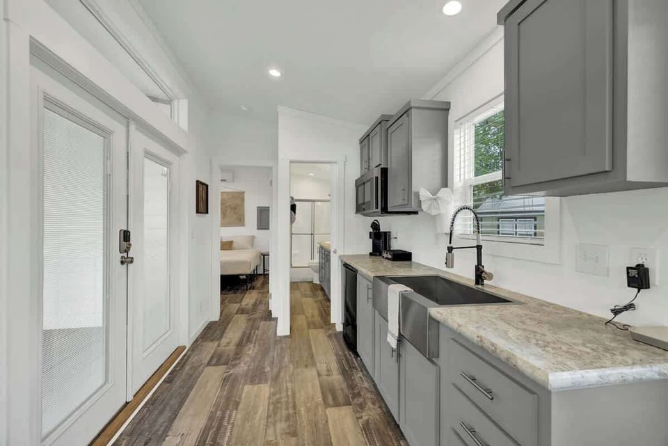 This cozy tiny home embodies warmth and comfort in its compact, inviting space.