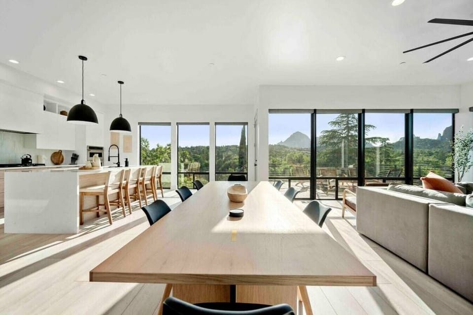 The dining area featuring expansive windows