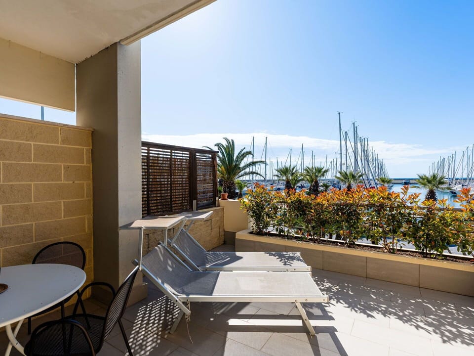 Furniture, Floor, Chair, Shade, Houseplant, Wood Stain, Balcony, Hotel, Flowerpot