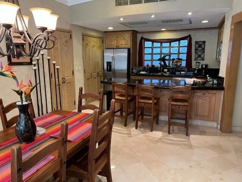 Open concept, Kitchen, laundry, full bath, dining, and living areas.