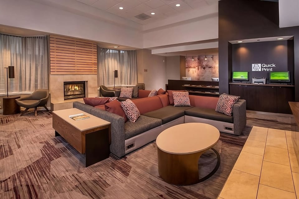 Unwind by the glowing fireplace in a stylish lounge setting
