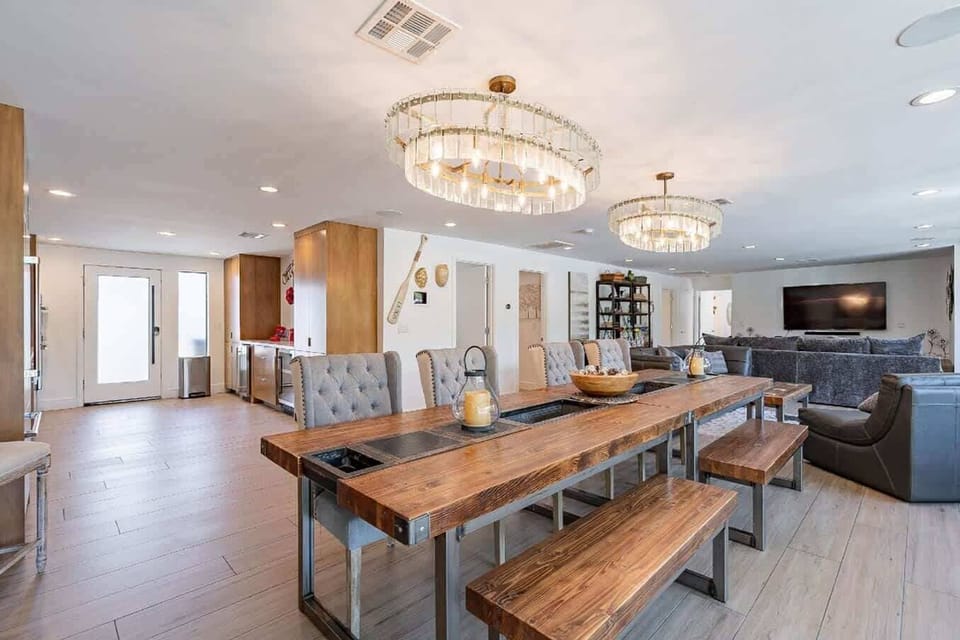 Kings table that can comfortably seat the entire party.  This seating area can open up to the backyard.
