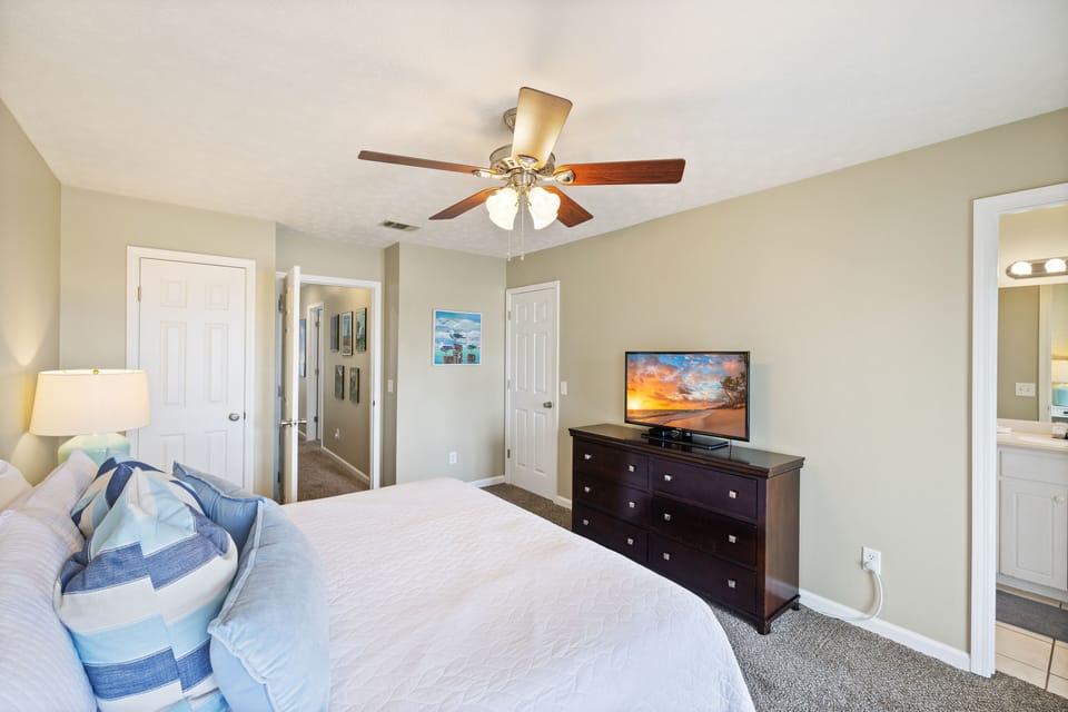 Bedroom 4 Upstairs offers a King Bed, Private Balcony, TV & Full Bath w/ tub/shower combo.