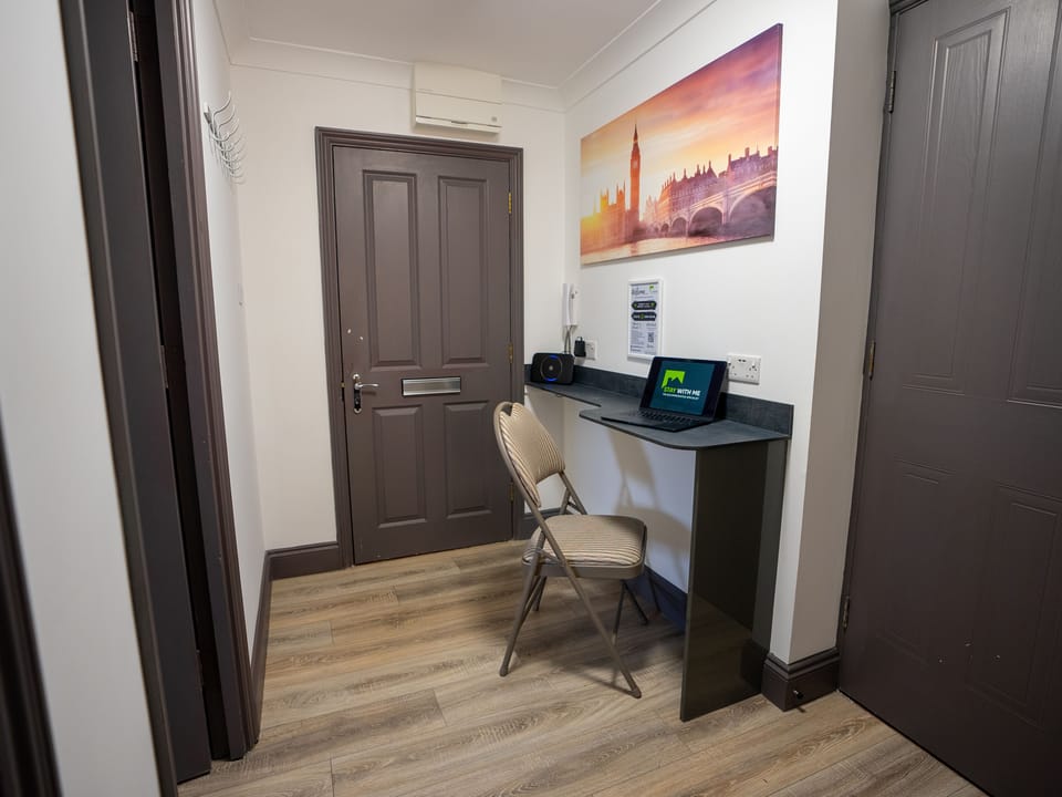 Perfect for remote work or study sessions, this corner features a sturdy desk and comfortable chair. Stay connected with high-speed Wi-Fi and enjoy a productive stay in this functional and inviting space.