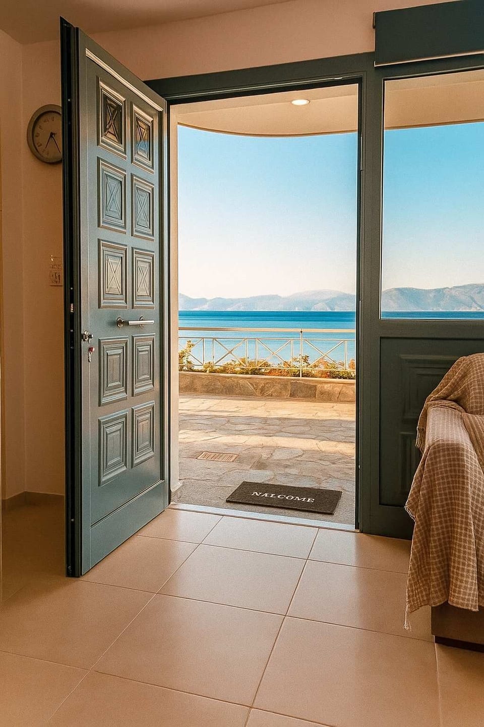 Entrance of the property – Open door, sea at your feet

