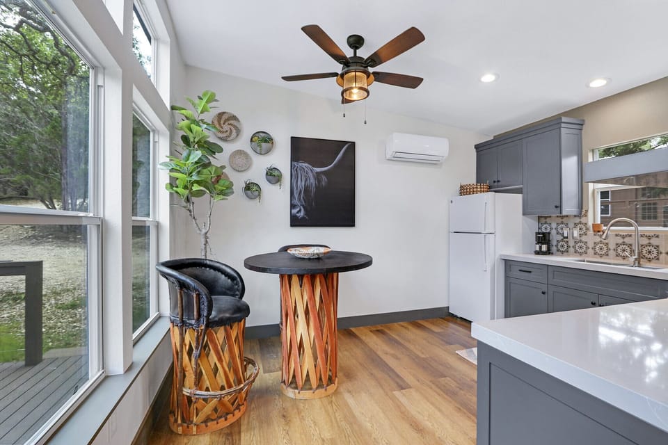 Looking left from the entrance you see the dining table and kitchen.