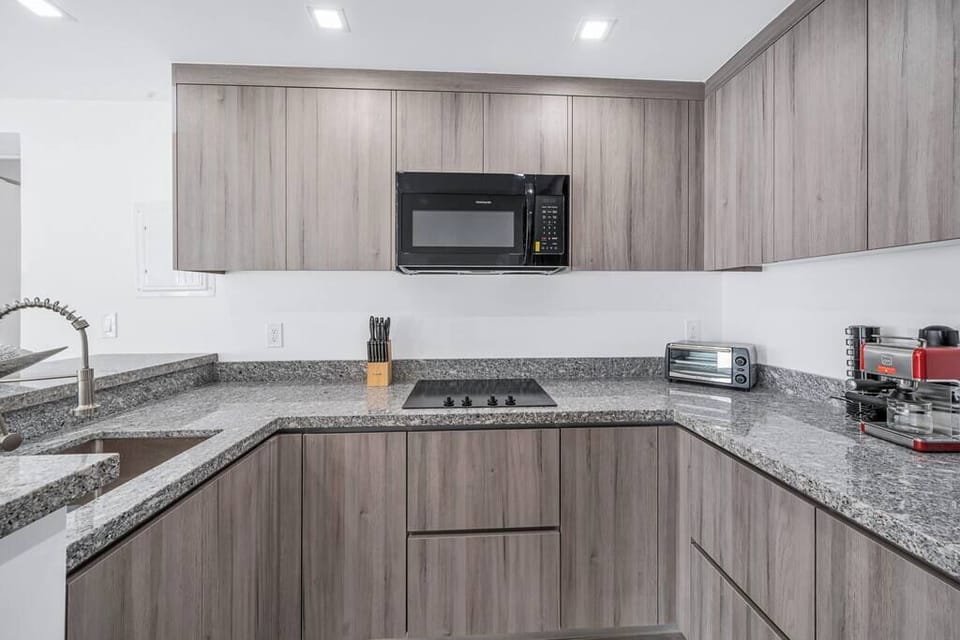 Fully Renovated and Equipped Kitchen. Marble tops and spacious cabinets to store all your family needs