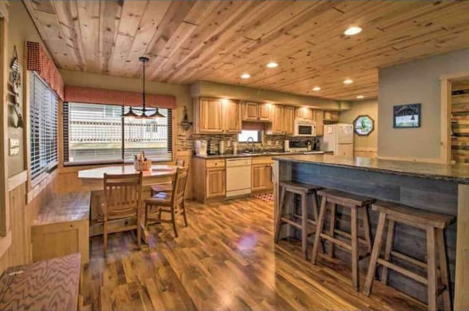 Plenty of seating at kitchen table nook and on both sides of island 
