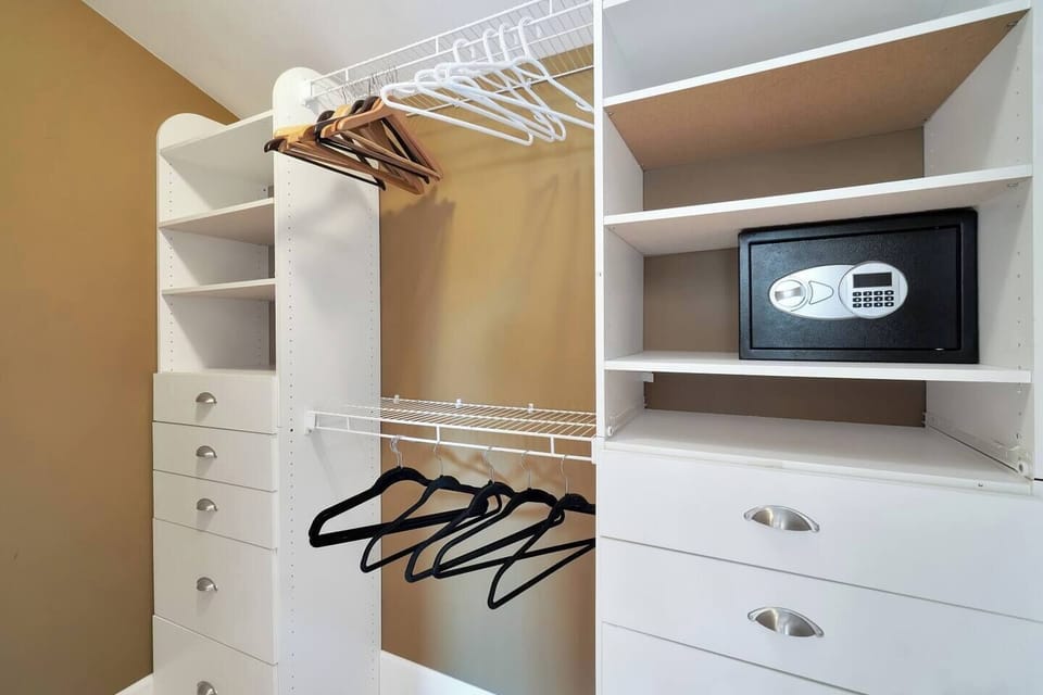 Walking closet with safe for master bedroom.
