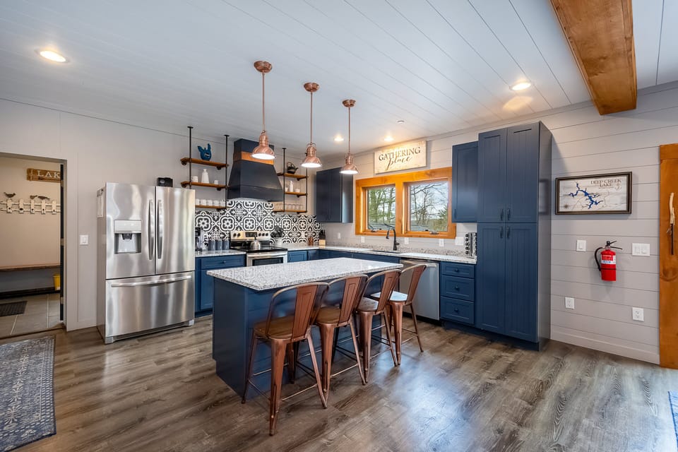 Kitchen has 4 bar seats at the island