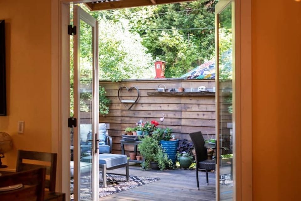 Large doors leading out to back deck.