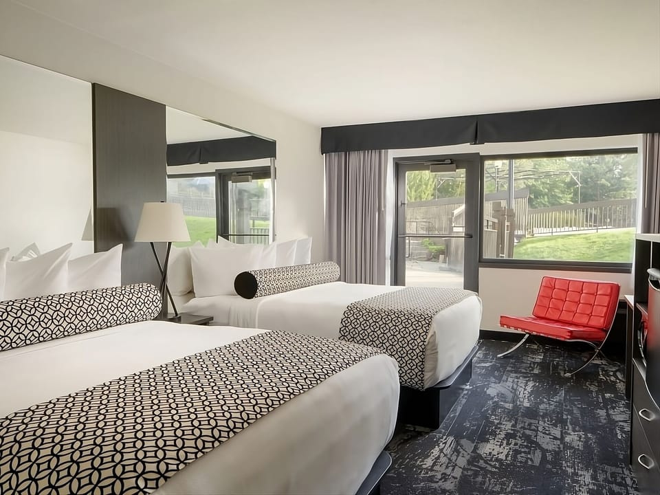 Unwind on plush doubles with garden views and quiet comfort.